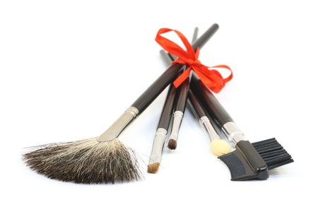 Make-up brushes with red bow isolated over whiteの写真素材