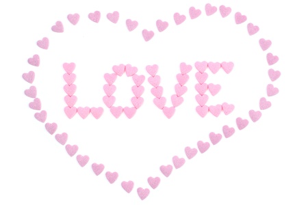 The word  love  en heart written with small candy heartsの写真素材