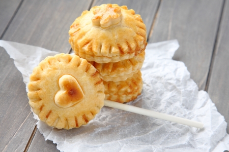 Pie pops with chocolate. Homemade shortbread cookies on a stickの写真素材