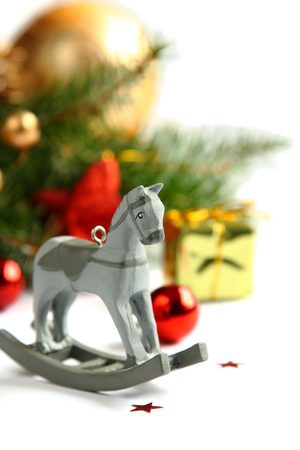 Christmas composition with wooden toy rocking horseの写真素材