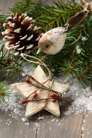 Christmas composition with star and branch of christmas treeの写真素材