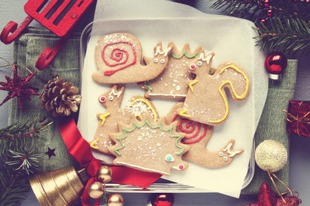 Homemade gingerbread animal-shaped cookies with icing, retro style