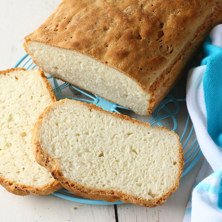 Homemade gluten free bread on blue metal gridの写真素材