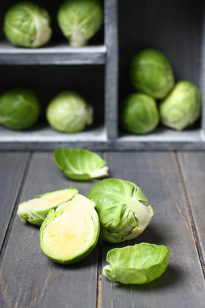 Fresh raw brussels sprouts on a wooden tableの写真素材