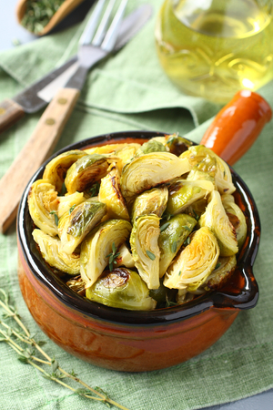 Vegetarian bowl of roasted brussel sprouts with garlic and thymeの写真素材