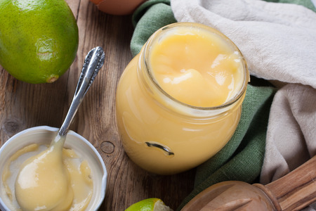 Homemade lime curd in glass jarの写真素材