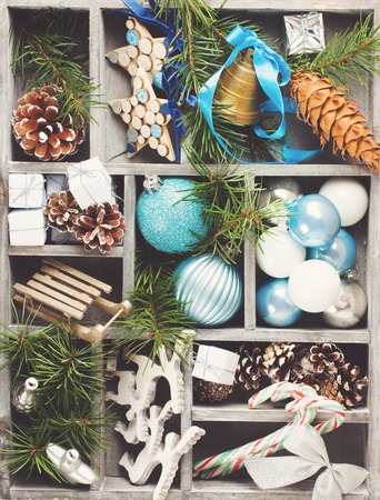 Christmas decoration with christmas tree branches in wooden box. Winter holidays concept.  Retro style toned.の写真素材