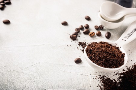 Glass bowl with red caviar and fresh baked homemade healthy bread on old white wooden table background. Helthy food.の写真素材