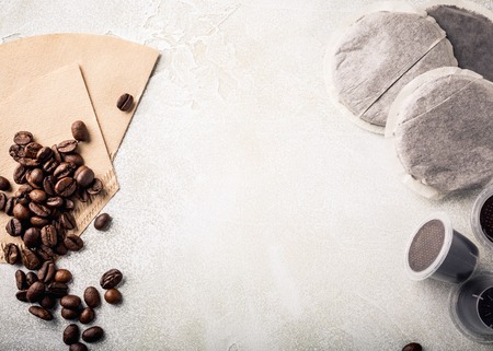 Background with assorted coffee, coffee beans, ground and instant, pads and capsules, retro style toned, copy space, top view.の写真素材