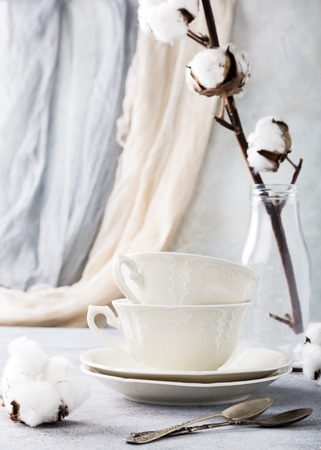 Two retro porcelain tea cups on light gray background. Copy space.の写真素材