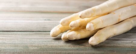 Spring season, new harvest of Dutch, German white asparagus. Healthy food concept with copy space. Selective focus. Banner.の写真素材