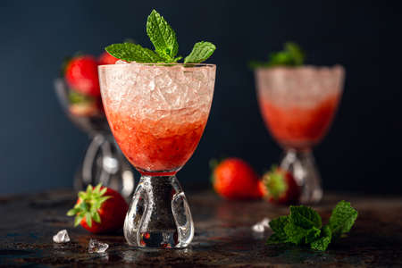 Fresh cocktail with crushed ice, strawberry and mintの写真素材