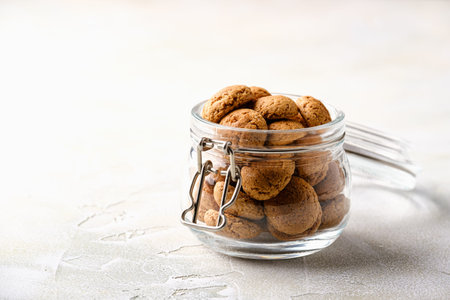 Kruidnoten cookies in glass jar. Pepernoten, traditional sweets, strooigoed. Dutch holiday...