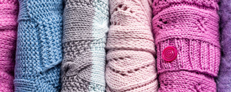 Banner with handmade woolen knitted warm wool sweaters. Autumn, winter season knitwear