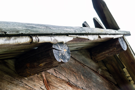 Use of birch bark to insulate roof on old timber building.の写真素材