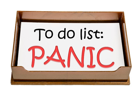 Brown paper tray with text "To do list: Panic".の写真素材