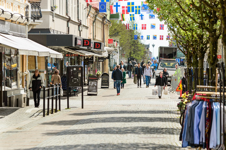 Karlshamn Sweden  May 06 2015: Normal day in the city of Karlshamn. People walk around on main street. Shops are open and trucks unload their goods.のeditorial素材