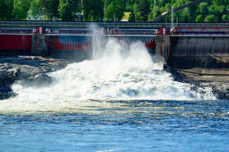 Water power station seen letting out water from the dam to keep water at the right level above the station.の写真素材