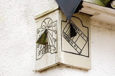 Edestad, Sweden - January 13, 2016: Two old and odd looking wooden sundials found on the corner of...