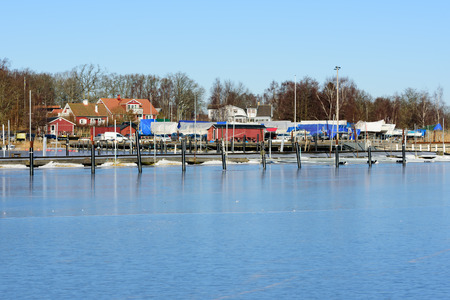 Listerby, Sweden - January 17, 2016: A view of the marina as seen from out at sea on a cold winters day.のeditorial素材