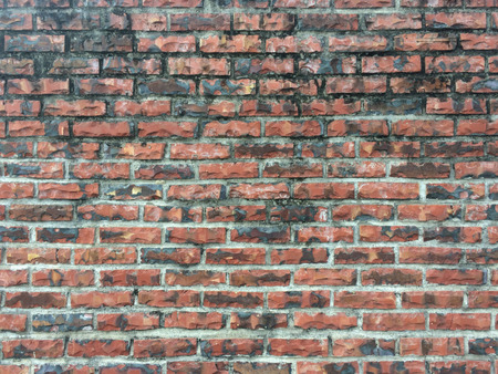 Old red brick wall texture background, close upの写真素材