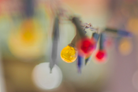 Christmas lights, Closeup, Christmas background with lights, Christmas lights border, Glowing colorful Christmas lights on backgroundの写真素材