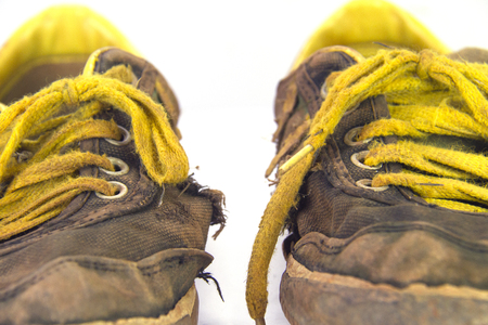 Dirty sneakers isolated on white background, Footwear for outdoor activitiesの写真素材