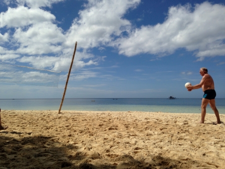 Complete the summer fun with beach volleyballの素材