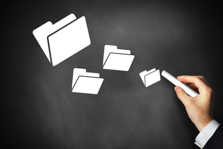 hand drawing data folders on black chalkboardの写真素材