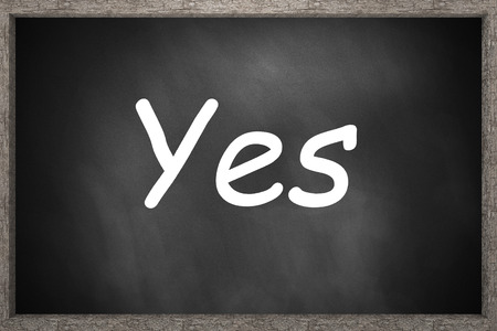 yes written on black chalkboard 3D Illustrationの写真素材