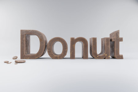 closeup of 3d lettering donut made of brown whole milk chocolate on clean surface chocolate crumbs;...