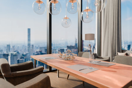 modern contemporary loft with couch and dining table and indoor plants vertical garden; panoramic view rural landscape; sustainability work environment; 3D renderingの写真素材