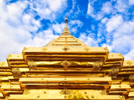 Golden stupa point to blue skyの素材