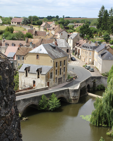 FRESNAY-SUR-SARTHE, JULY 14 2017: View of part of the town of Fresnay on the river Sarthe from the castle ruins. It is a small historic town in Pays de Loire, and a less well known tourist destinationのeditorial素材