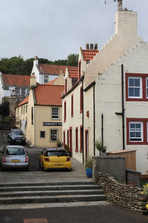 KIRKCALDY, SCOTLAND, JULY 20 2018: View of the historic old buildings on Burns Wynd in the village of West Wemyss near Kirkcaldy in Fife. This coastline is a popular tourist destination in Scotland.のeditorial素材