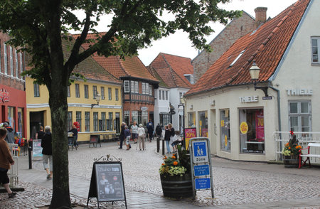 RIBE, DENMARK, 12 JULY 2019: A view of Nederdammen shopping street in Ribe, on a week day in the summer. Ribe is an ancient town in Denmark and a popular tourist destination in Jutland.のeditorial素材