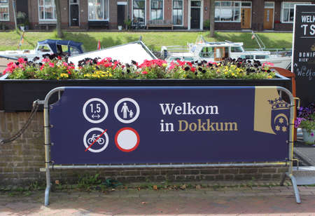 DOKKUM, NETHERLANDS, 22 JULY 2020: Signage saying 'Welcome to Dokkum' showing physical distancing regulations in Friesland. Regulations are in place to help combat the spread of the COVID 19 virus.のeditorial素材