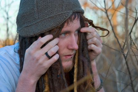 a scared guy in the forest.の写真素材