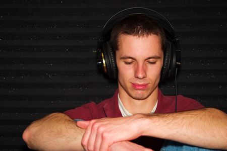 A Guy listening to music in isolation roomの写真素材