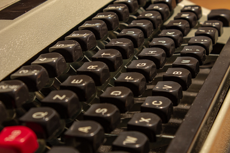An old typewriter. Press to key to the letter of the corresponding alphabet, starting with the paperの写真素材