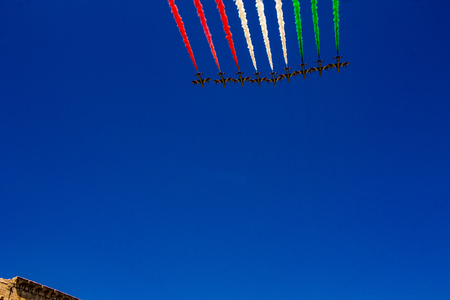 Rome, Italy, 02 / June / 2019. For the feast of the republic, the three arrows representing the Italian flag fly over the Colosseum and the Imperial Forums.のeditorial素材