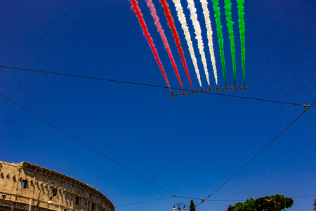 Rome, Italy, 02 / June / 2019. For the feast of the republic, the three arrows representing the Italian flag fly over the Colosseum and the Imperial Forums.のeditorial素材