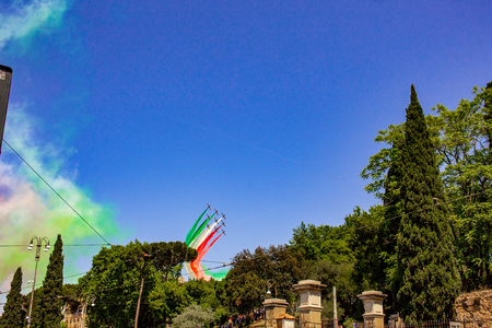 Rome, Italy, 02 / June / 2019. For the feast of the republic, the three arrows representing the Italian flag fly over the Colosseum and the Imperial Forums.のeditorial素材