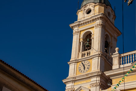 Bacoli, Naples. the bell tower of the main church, with the clock in the foreground.
