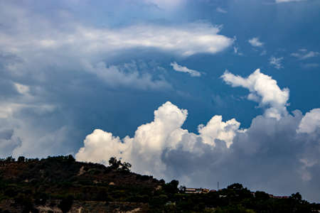 The blue sky in the background makes the cloud stand out. The cloud takes many forms.の写真素材