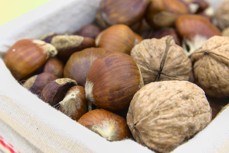 In the foreground the chestnuts and walnuts, typical fruit of the Christmas periodの写真素材