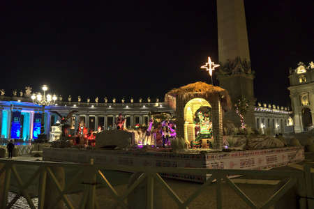 Piazza San Pietro, the nativity scene, and the Christmas tree decorated with gold-colored lightsの写真素材
