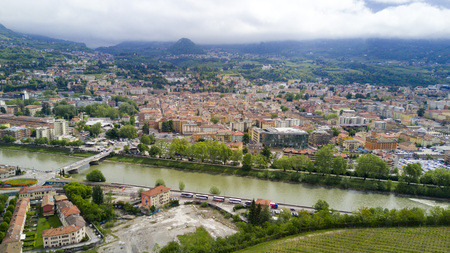 Shooting with drone on Trento, famous Trentino city near the Adige river in northern Italyの写真素材