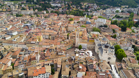 Shooting with drone on Trento, famous Trentino city near the Adige river in northern Italyの写真素材