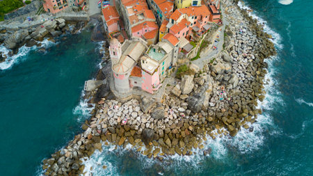 Aerial shooting with drone on Tellaro, famous Ligurian village near the Cinqueterre, small colored houses built on the cliff by the seaの写真素材